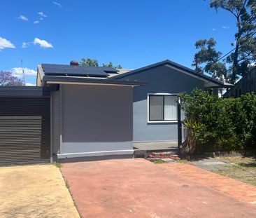 Fully Renovated 3 bedroom Home with 2 bedroom retreat - Photo 1