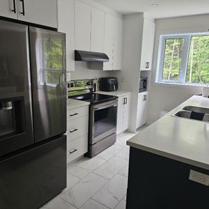 Magnifiques logements neuf 4 ½ avec ascenseur unique ! 450 775.1379 - Photo 2