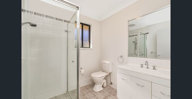 SPACIOUS FAMILY HOME IN A QUIET WOONGARRAH LOCATION - Photo 1