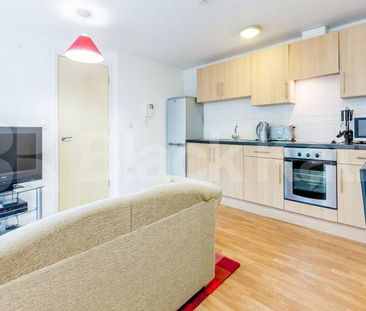 1 bedroom apartment located within a gated development with a balcony - Photo 2