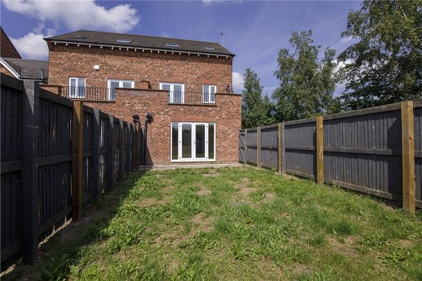 Well-presented and deceptively spacious three bedroom, three-storey semi detached in this cul-de-sac on the sought after estate in Harworth. - Photo 1