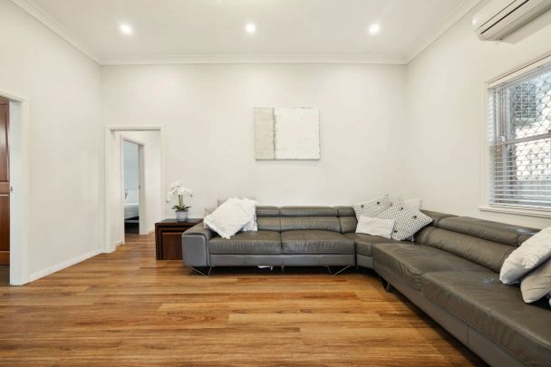 Stylishly updated north-to-rear facing home set on a tree-lined street - Photo 1