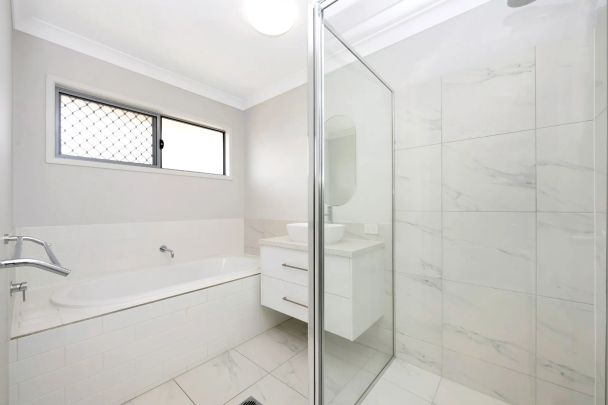 Spacious 4-Bedroom Home with Modern Comforts - Photo 1