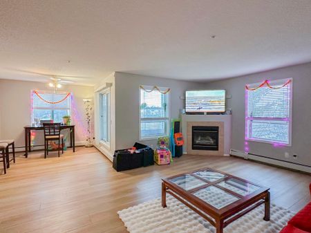 Spacious 2 Bed, 2.5 Bath Condo In Shawnessy | Fireplace, Balcony & Rent Incentive - Photo 3