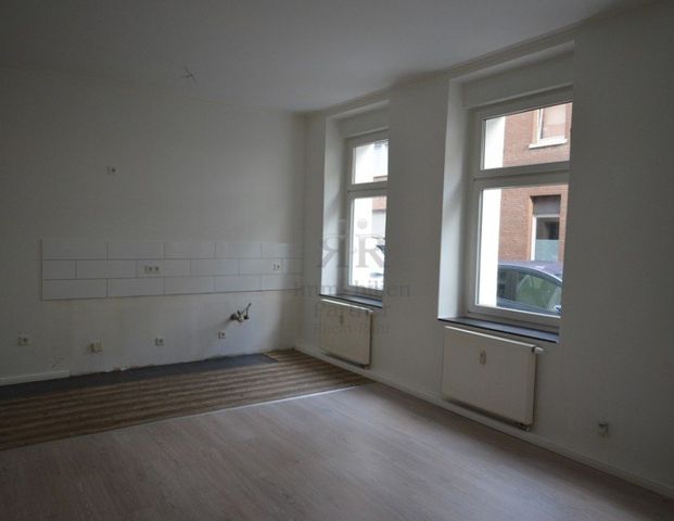 Renovierte 2-Raumwohnung im EG in energetisch saniertem Haus! Auch für ältere Bewohner geeignet! - Photo 1