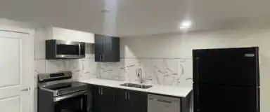 New, recently developed Walk-out basement suite with huge green space area | Calgary - Photo 1