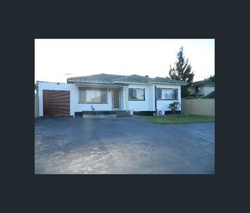 Spacious Family Home with Great Outdoor Living in Lurnea - Photo 5