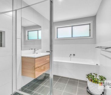 Beautiful 4-Bedroom Family Home with Modern Comforts - Photo 1