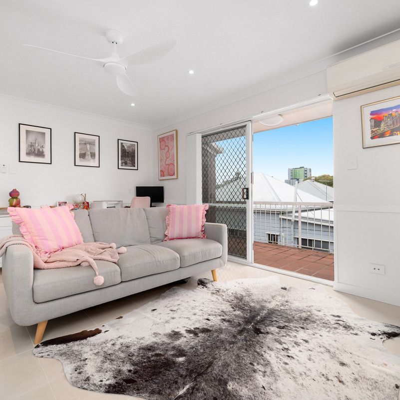 RENOVATED INNER-CITY RETREAT WITH BALCONY & LOCK-UP GARAGE - Photo 1