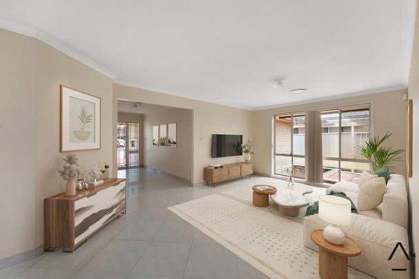 Discover your perfect family retreat, nestled in the heart of Casula! - Photo 1