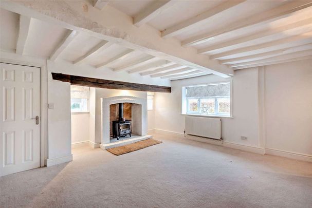 Stylish modernised farmhouse with lovely gardens, well located on the semi-rural outskirts of Wilmslow - Photo 1