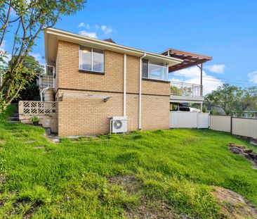 Freshly Updated Family Home with Sunroom & Covered Deck - Photo 6