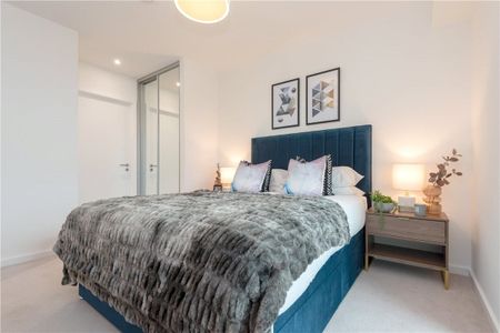 This contemporary two-bedroom apartment is located within Wallbrook Gardens, a beautiful development benefitting from exceptional on-site amenities, communal gardens and only a 6-minute walk to Canning Town Station. - Photo 5