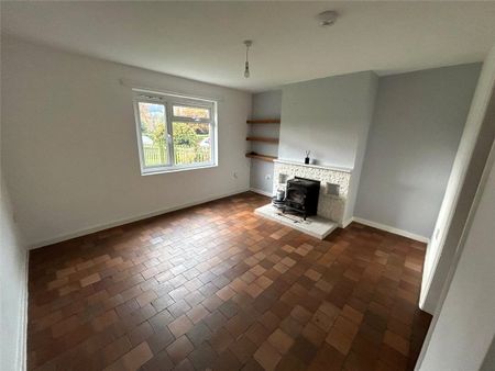 A three-bedroom semi-detached cottage located in the village of Llangedwyn. - Photo 2