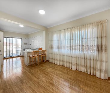 Spacious 2-Bedroom Ground Floor Unit with single Remote Garage & Wa... - Photo 1