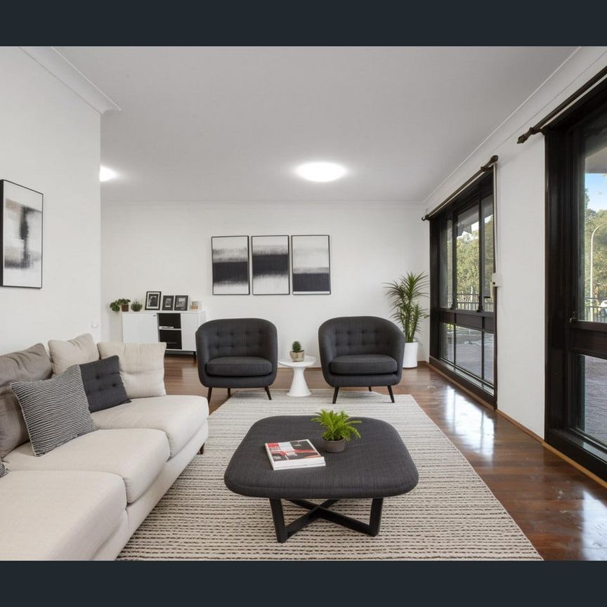 Family-Sized 4-Bedroom Home with Water Included - Photo 1