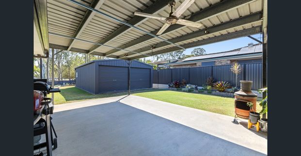 Renovated home with shed and outdoor living - Photo 1