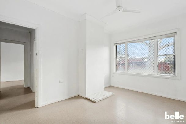 Comfortable 3-Bedroom Home with Spacious Yard in a Convenient Location - Photo 1