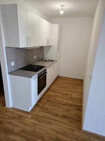 Neubau-Erstbezug mit Balkon, Fernblick & Top-Anbindung in Simmering - Photo 4