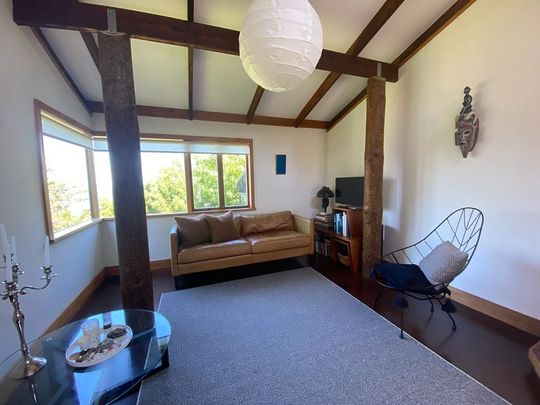 Charming 2BR Home with Lush Garden - Photo 1