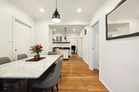 Stylishly updated north-to-rear facing home set on a tree-lined street - Photo 5