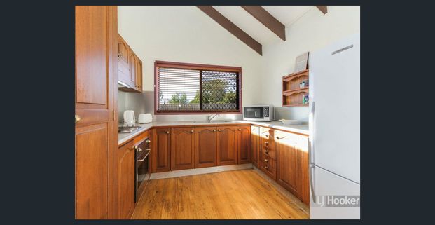 Spacious Family Home with Huge Shed and Outdoor Entertaining Walk to Grand Plaza! - Photo 1