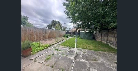 Spacious 3-Bedroom Home with Sunroom & Great Backyard - Photo 2