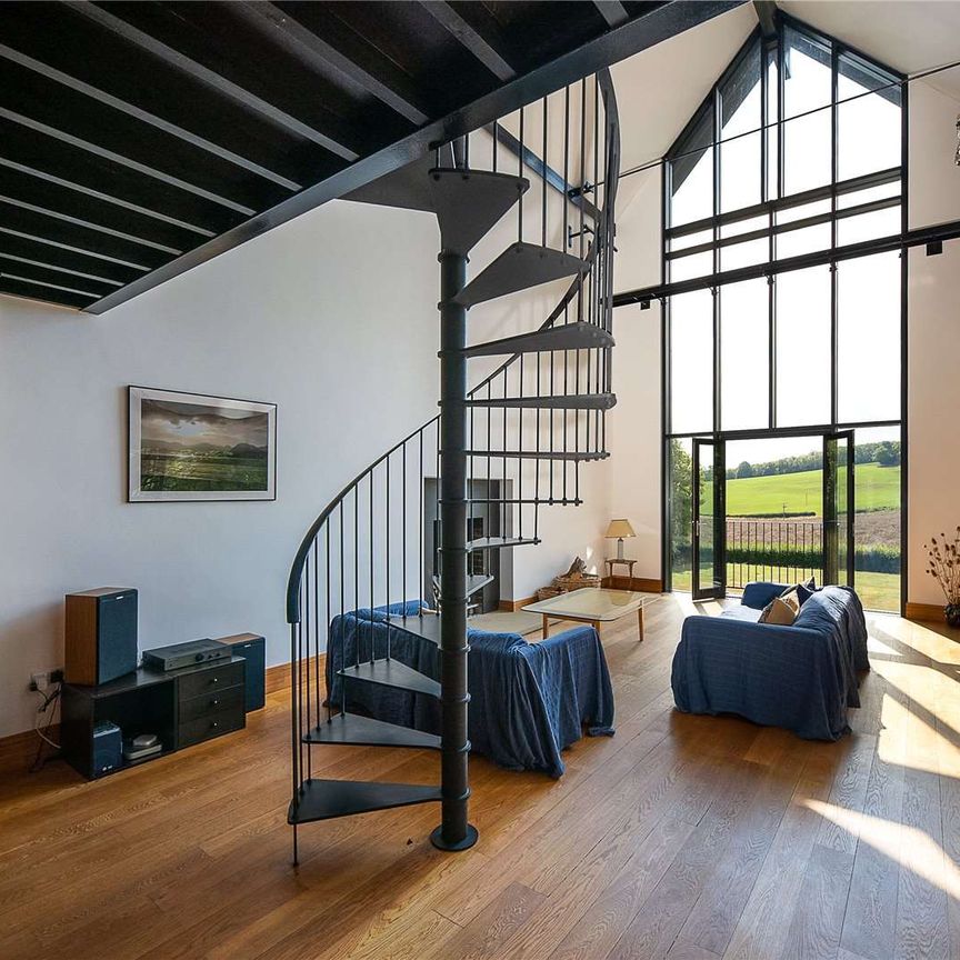 In a private and elevated position, enjoying wonderful far reaching views is this superbly designed individual home. - Photo 1