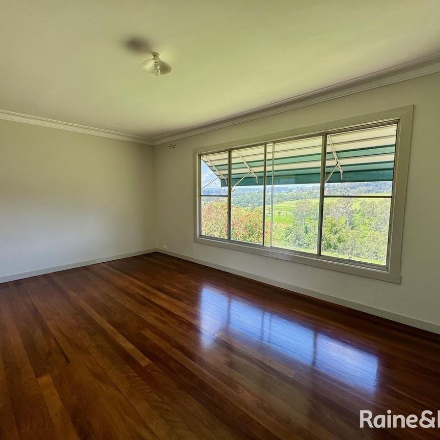ELEVATED FARMHOUSE WITH SHED - Photo 1