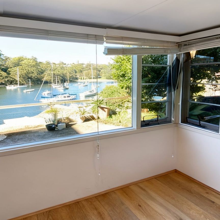 TRANQUIL WATERFRONT RETREAT WITH CAPTIVATING BAY VIEWS - Photo 1