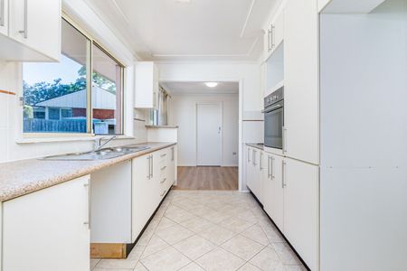 Charming Family Home with Spacious Layout & Low-Maintenance Yard - Photo 5