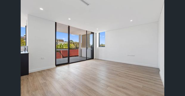 FIRST FLOOR & NEAR NEW THREE BEDROOM APARTMENT WITH STUDY NOOK & TWO CARSPACES - Photo 1