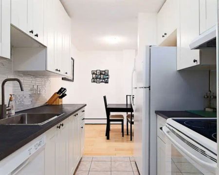 315 Heritage Drive SE (Village Green) - Unit 229, Calgary - Unit 229 — 2 Bedroom - Photo 2