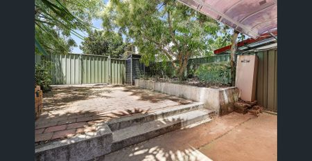 Stunning Renovated 2 Bedroom Home + Spacious Attic in Premier Location - Photo 4