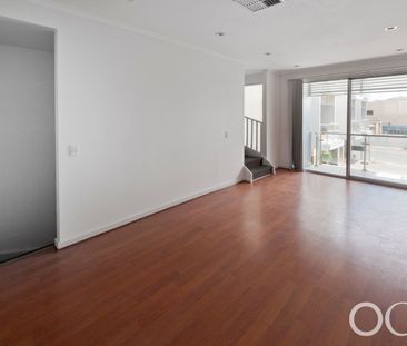 Open the Door to City Serenity with a Private Balcony - Photo 2