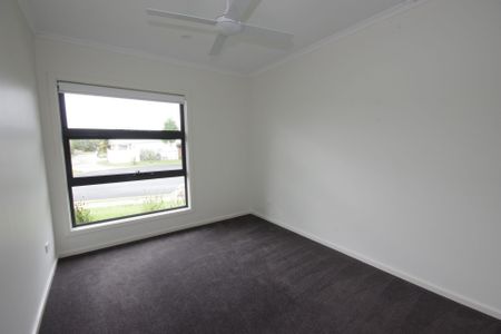 Set in the exclusive "Korora Beach Estate", this home ticks all the boxes! - Photo 3