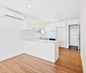 Two Bedroom Top Floor Unit in a Stunning Location with Water Views! - Photo 5