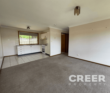 SECURE TWO BEDROOM UNIT IN GREAT LOCATION - Photo 1
