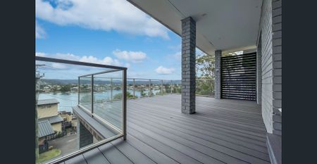 Furnished Coastal Retreat with Water Views & Modern Luxury - Photo 4