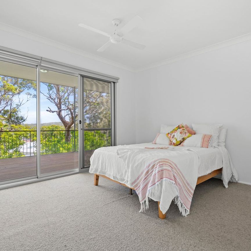 Elevated Three-Bedroom Home with Large Deck - Photo 1