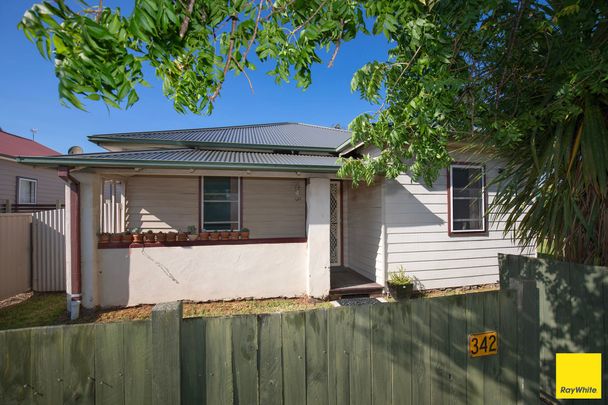 Charming Three Bedroom Home - Photo 1