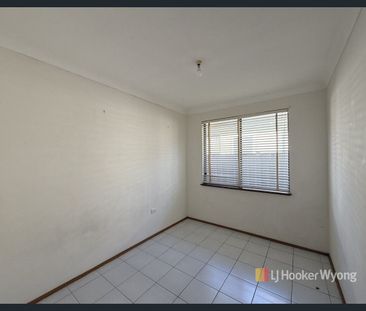Charming Three-Bedroom Home with Multiple Living Areas & Large Alfr... - Photo 2
