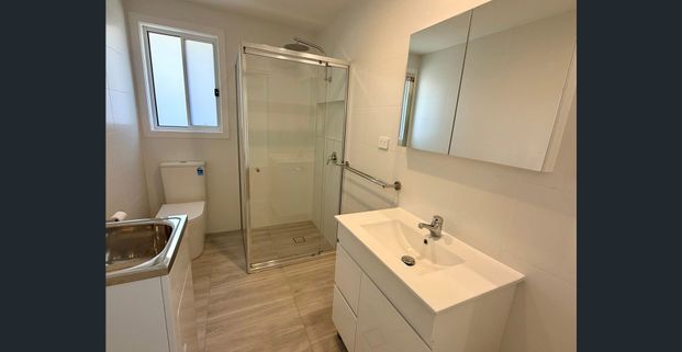 BRAND NEW GRANNY FLAT WITH SECURE PARKING + CARPORT!! - Photo 1