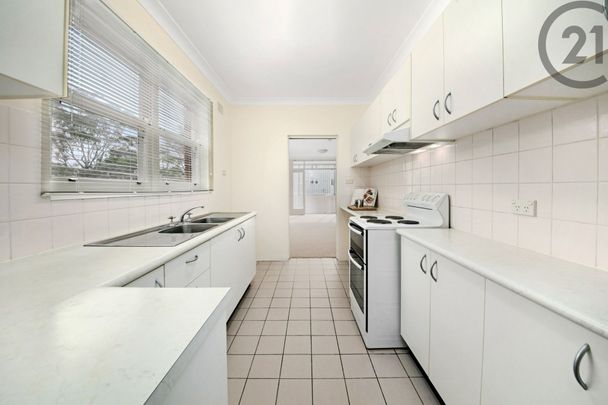 Large&comma; Sunfilled Apartment&comma; Sunroom&comma; Lock up Garage and Exceptional Value&period; - Photo 1