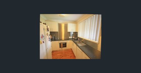 Well-Maintained Three-Bedroom Home - Photo 3