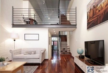 Stunning tri-level townhouse in historic warehouse conversion - Photo 3