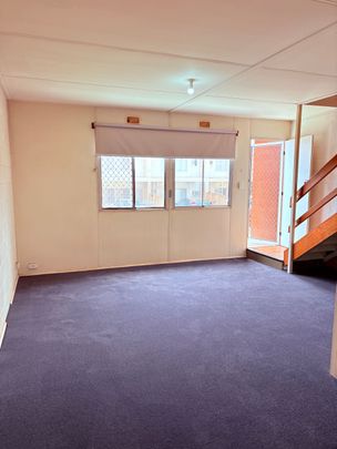 Two-storey, two-bedroom unit - Photo 1