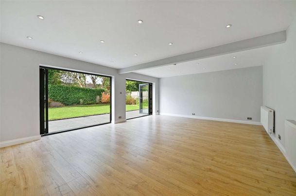 This beautifully refurbished 5/6-bedroom detached home is set in a quiet spot with stunning Chiltern Hills views, offering spacious, light-filled accommodation finished to a high standard. - Photo 1