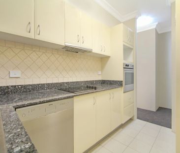 MODERN TWO BEDROOM UNIT IN CONVENIENT LOCATION - Photo 2