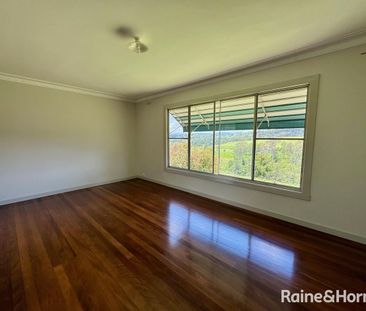 ELEVATED FARMHOUSE WITH SHED - Photo 1
